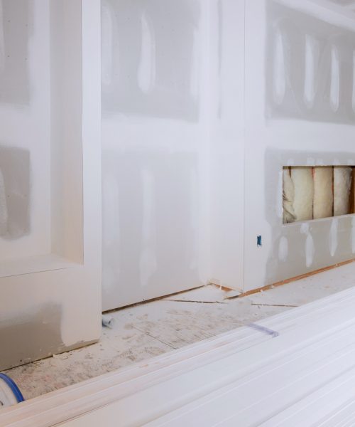 House hall interior with drywall completely installed and painted wall