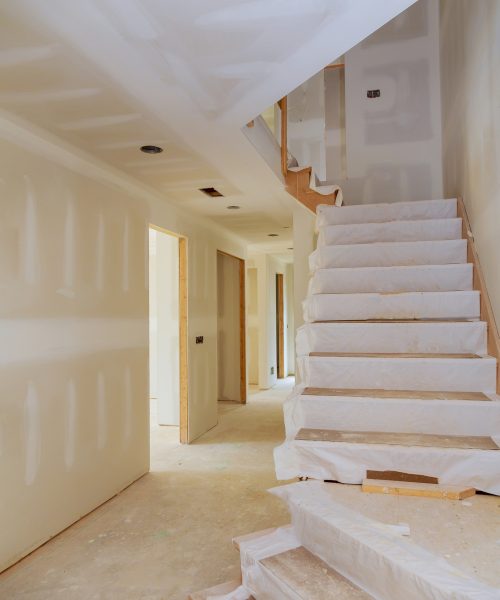 New home interior construction of housing with drywall installed